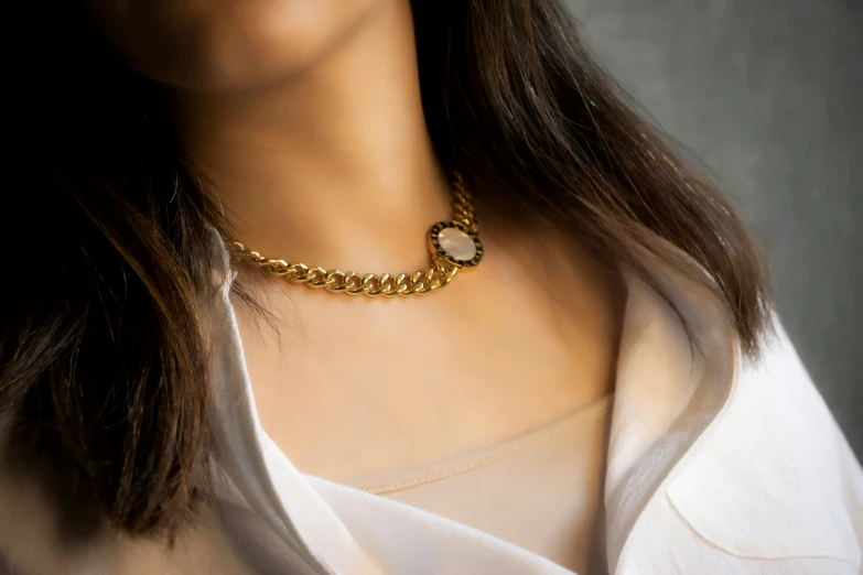 a woman's neck chain with jewelry in the center