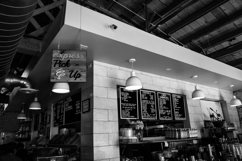 a black and white image of the inside of a cafe