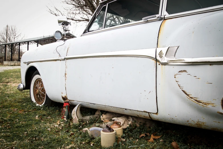 this is an old white car with an american flag on it