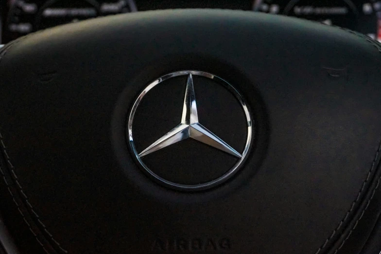 the steering wheel controls of a mercedes - benz car