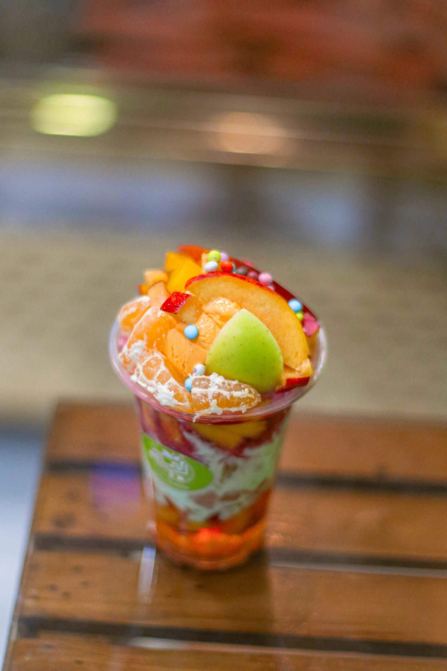 an ice cream sundae sitting on top of a wooden table