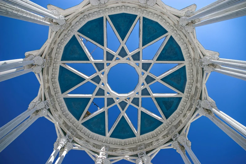 looking up at the structure in the blue sky