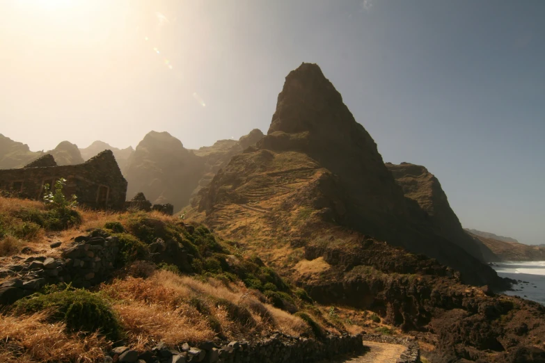 the rocks in the area near the beach are shaped like mountains