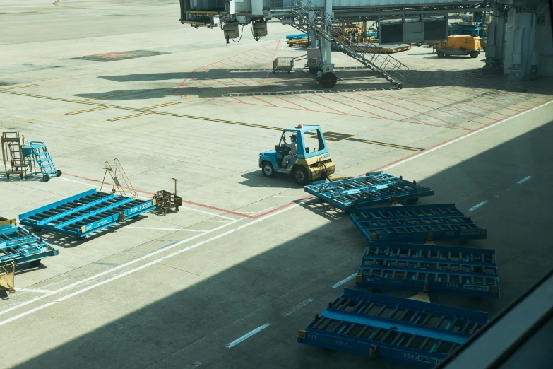 there are some trucks parked on the tarmac at the airport