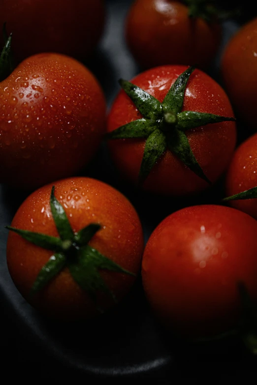 there are many tomatoes laying on a plate