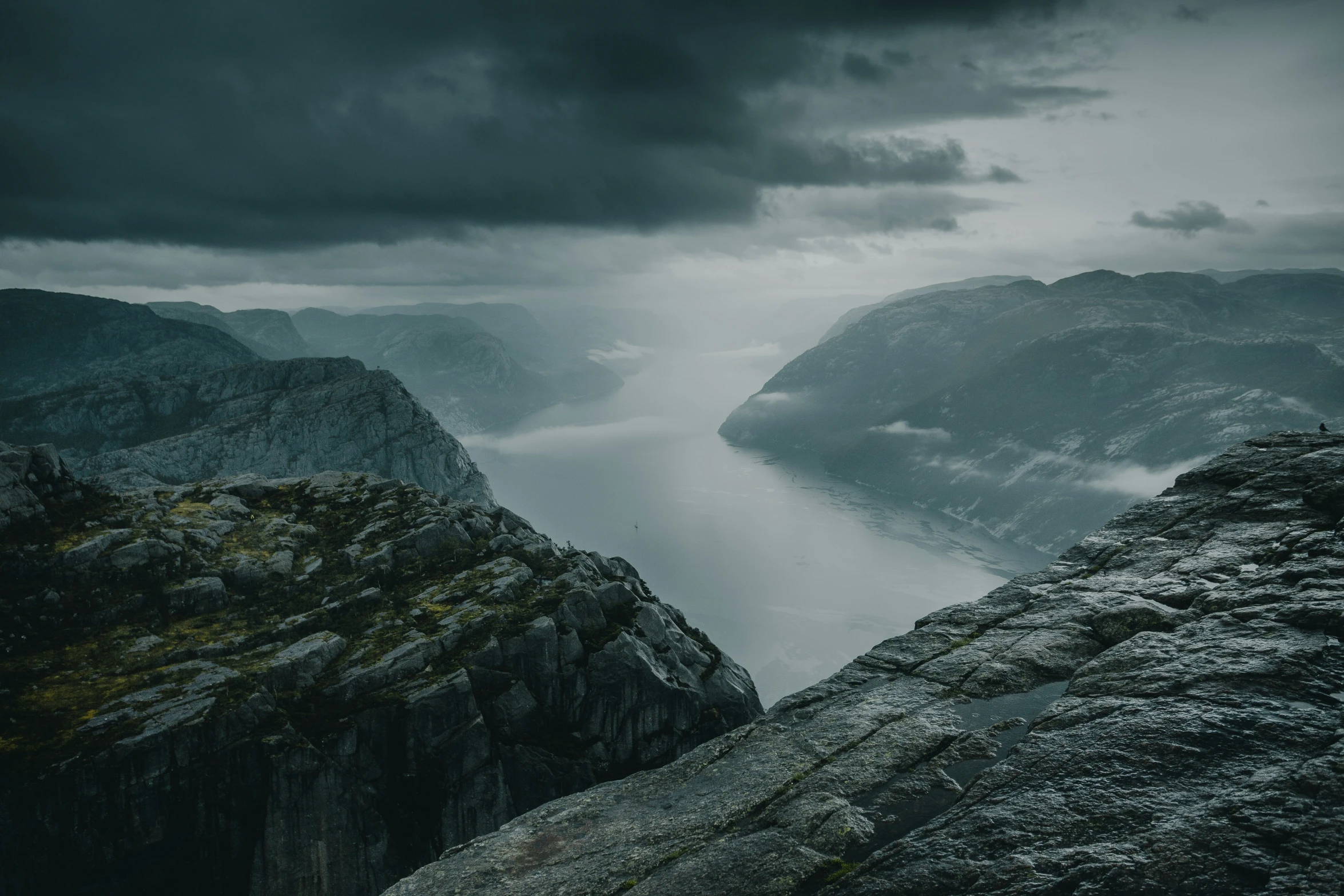 a storm approaches as it passes over mountains