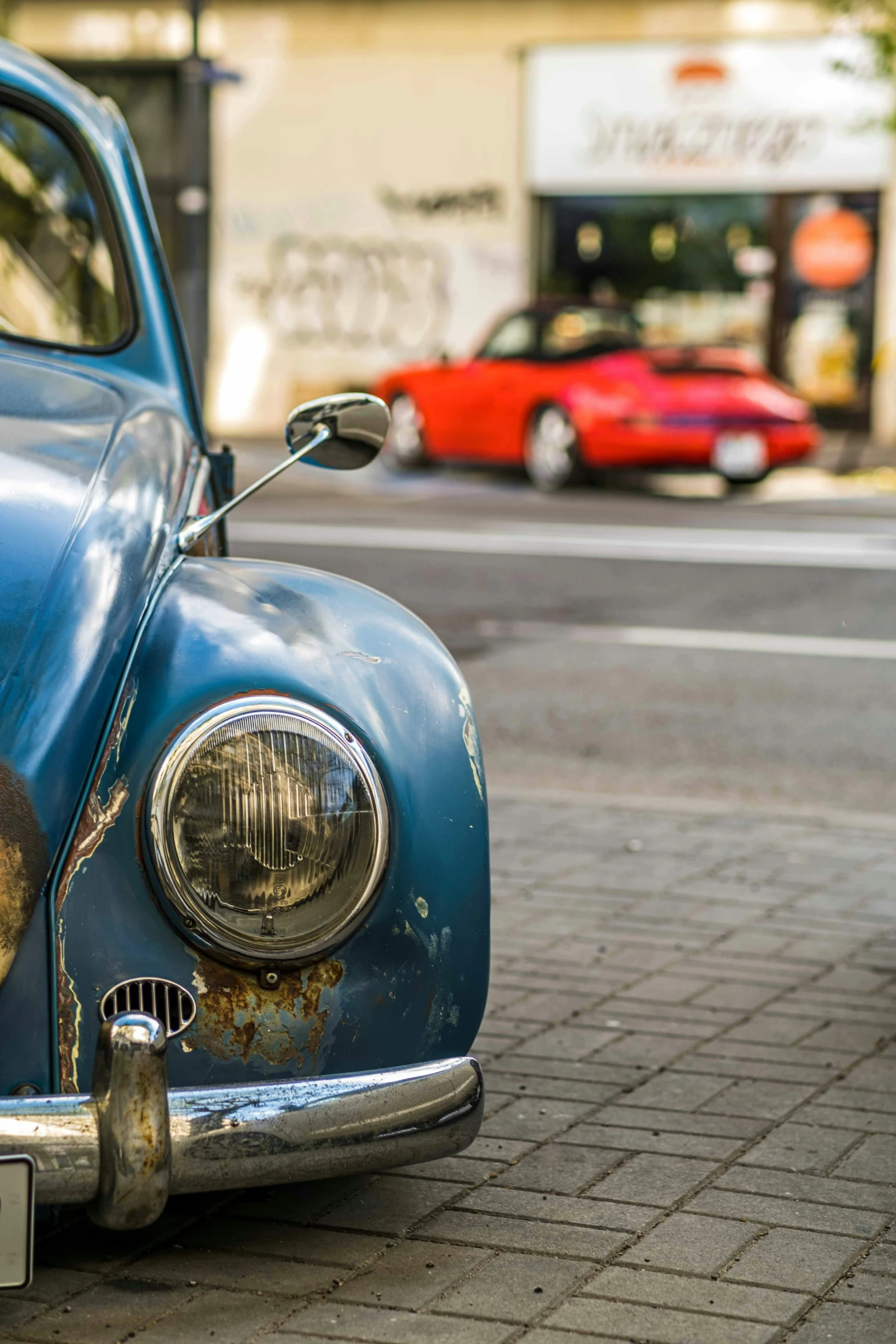 a car that has rusted out is parked in a lot