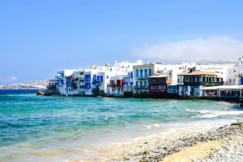 the water and white buildings by the shore