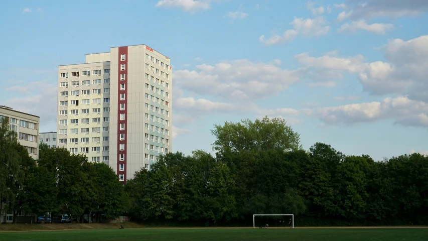 several tall buildings in a park on a clear day