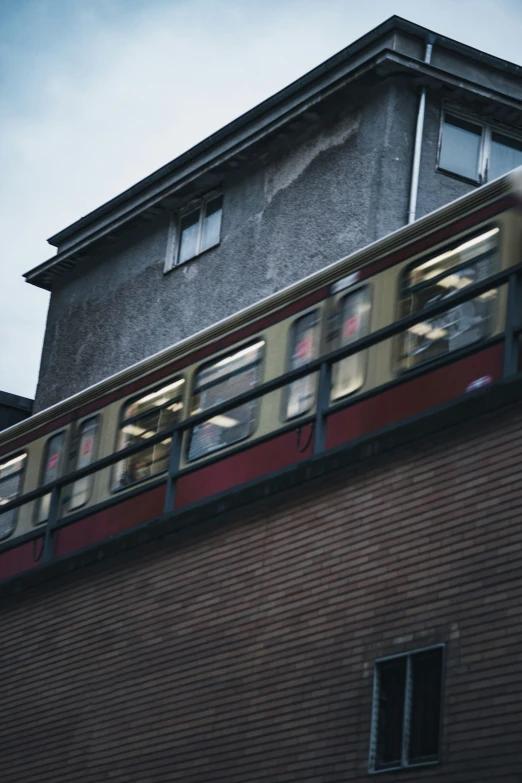 a train that is passing by a building