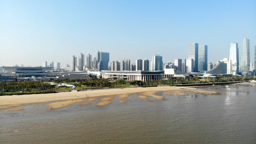 large city skyline overlooking a large waterway with high rise buildings