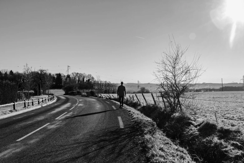 an image of a person walking on a snowy road