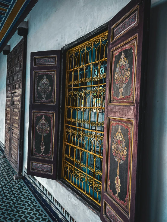 some large wooden window in a very long room