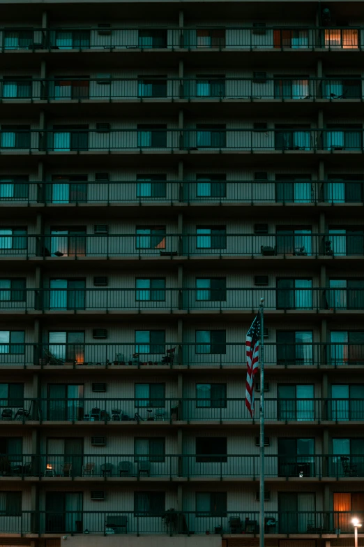 there is a building with the american flag waving in front of it