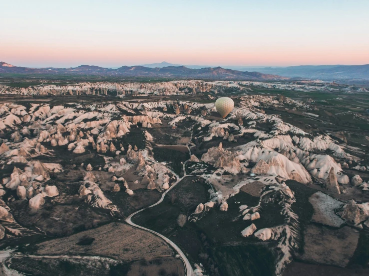 a huge field covered in white rocks and dirt