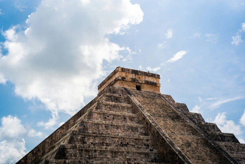 an ancient building made of bricks is against the sky