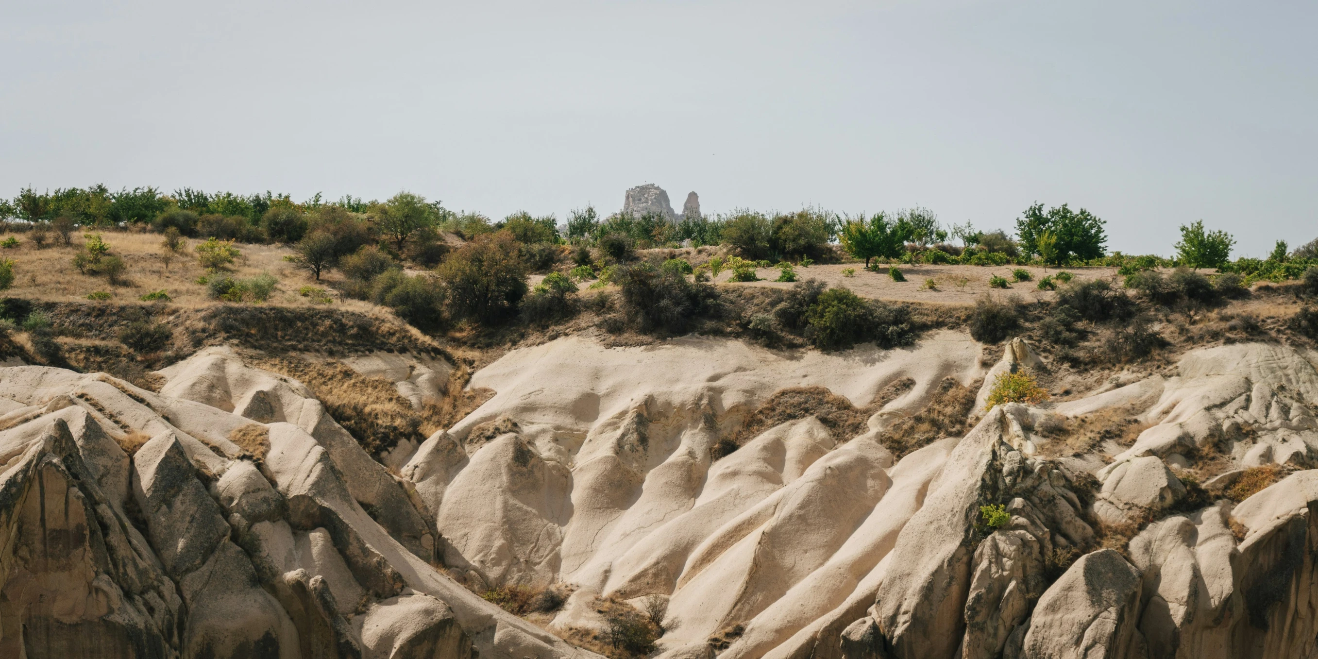 the rock formations with the dirt mountains near by