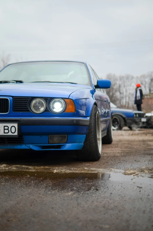 a bmw on the street and a car