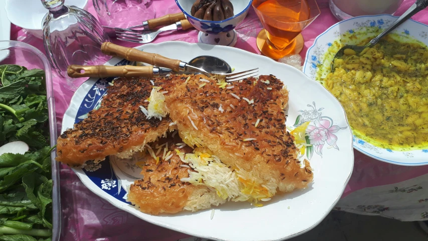 a plate with two sandwiches and green beans on it