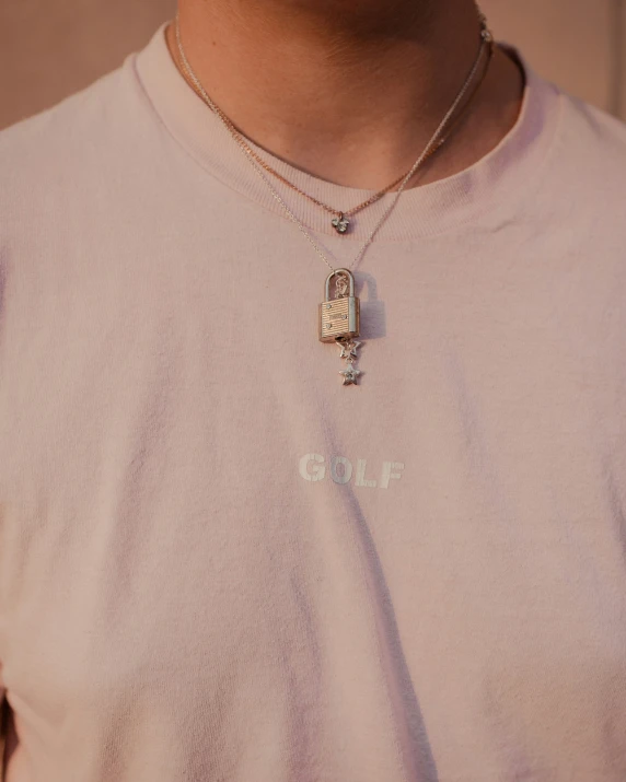 a person wearing a pendant on a neck