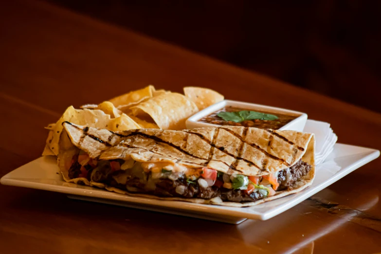 some chips and a sub on a plate