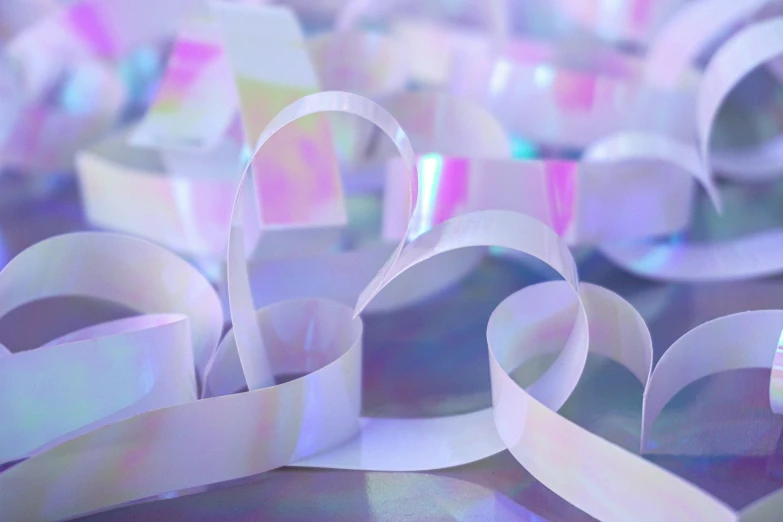 many different colors of ribbons with white, pink and blue