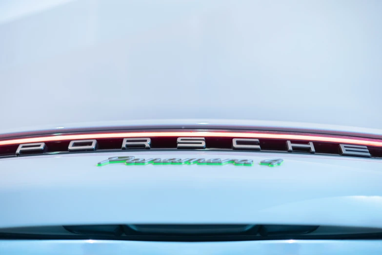 the name porsche is shown on the side of the car