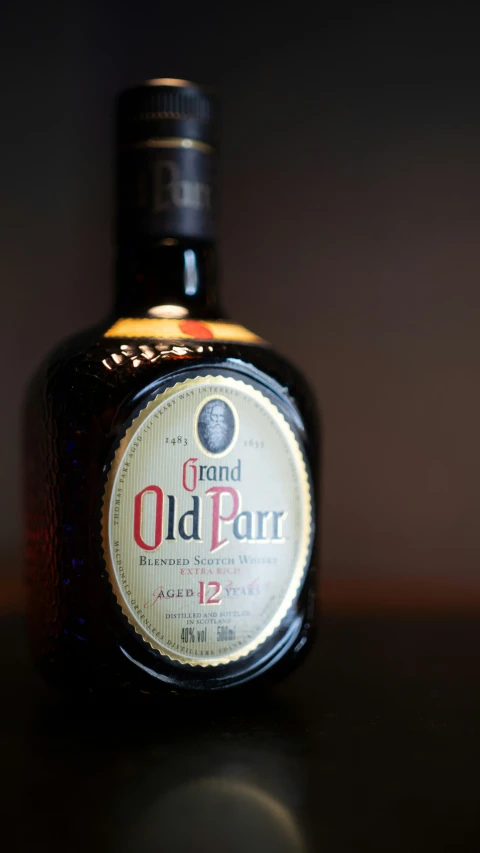 a bottle of old parr and some kind of wine