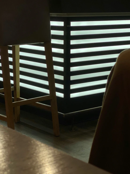 the sunlight is shining down onto a dark room with two chairs