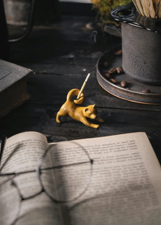 a little yellow dog figurine on the floor