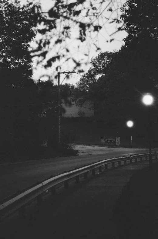 a dark po of street lamps and trees