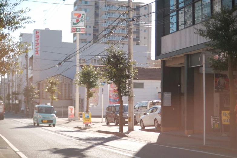 a street scene with cars parked on the side of the street