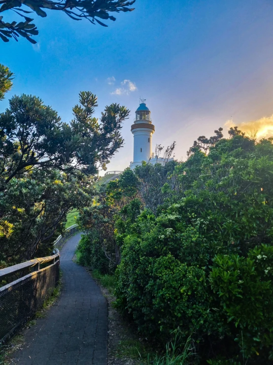 an image of a path leading to a light house