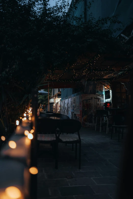 a long narrow covered patio with a small fire pit