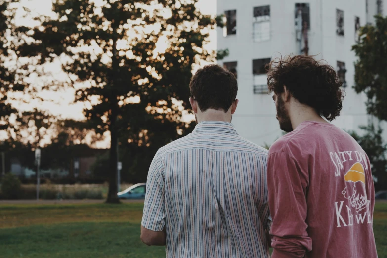 a couple of men standing next to each other