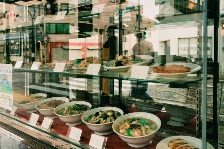 various bowls and bowls are in a window