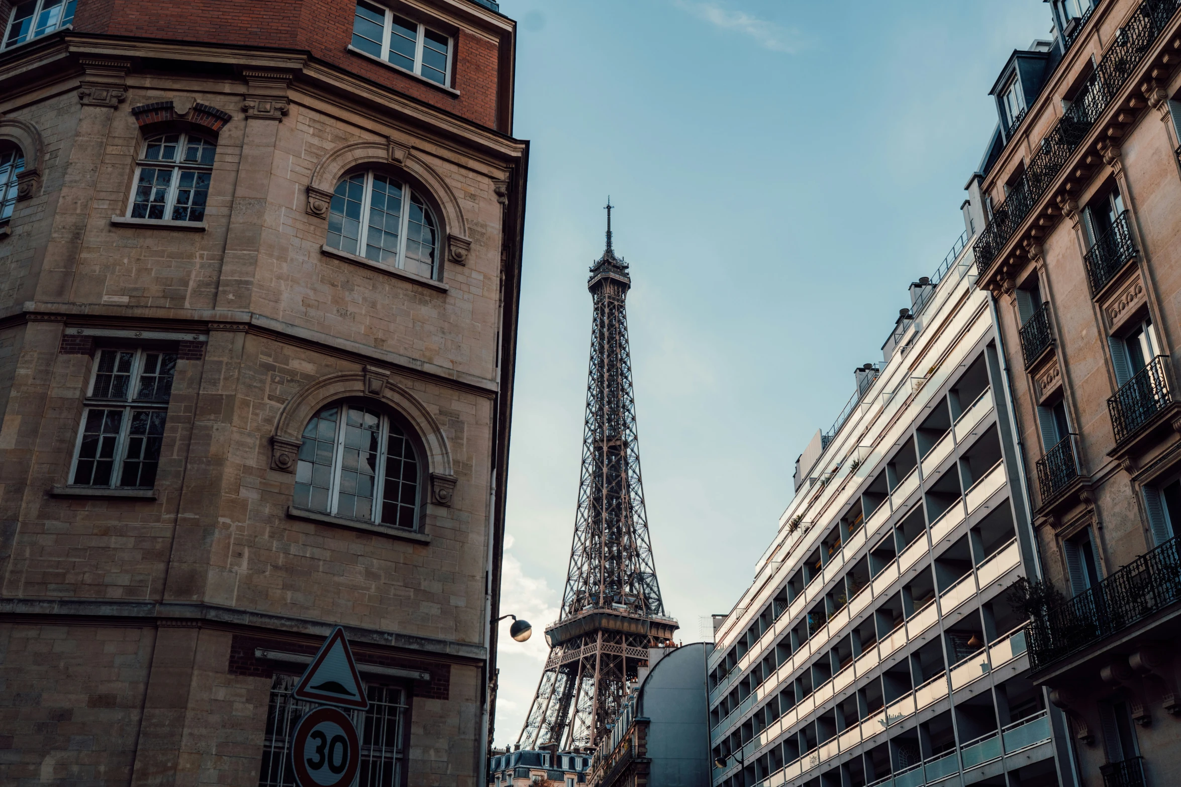 the eiffel tower towering above the buildings in paris