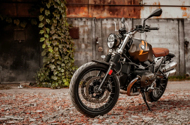 a motorcycle is parked outside by an old building