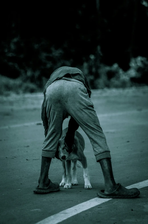 a person bent over with their feet on a skateboard