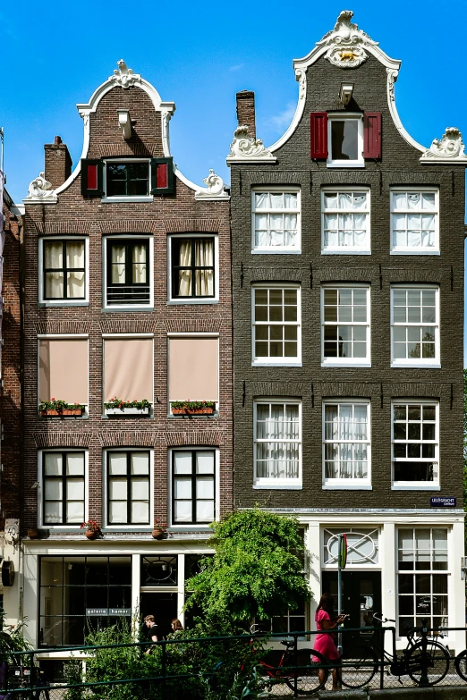 two brick houses that are connected to one another