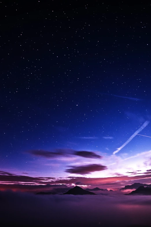 night sky with clouds and stars and purple colors