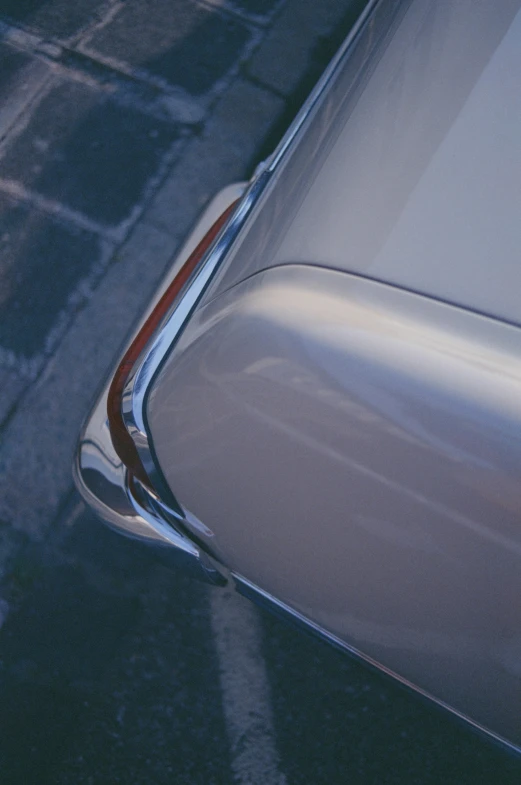 an older car is parked in a lot with no doors