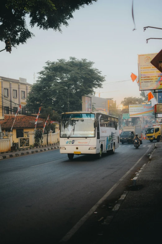 a bus drives down the street in a town