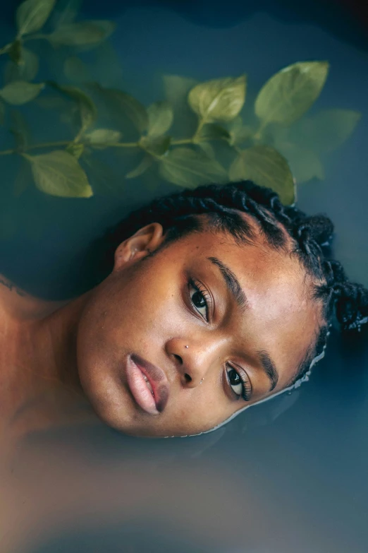 a young black woman in a blue bath