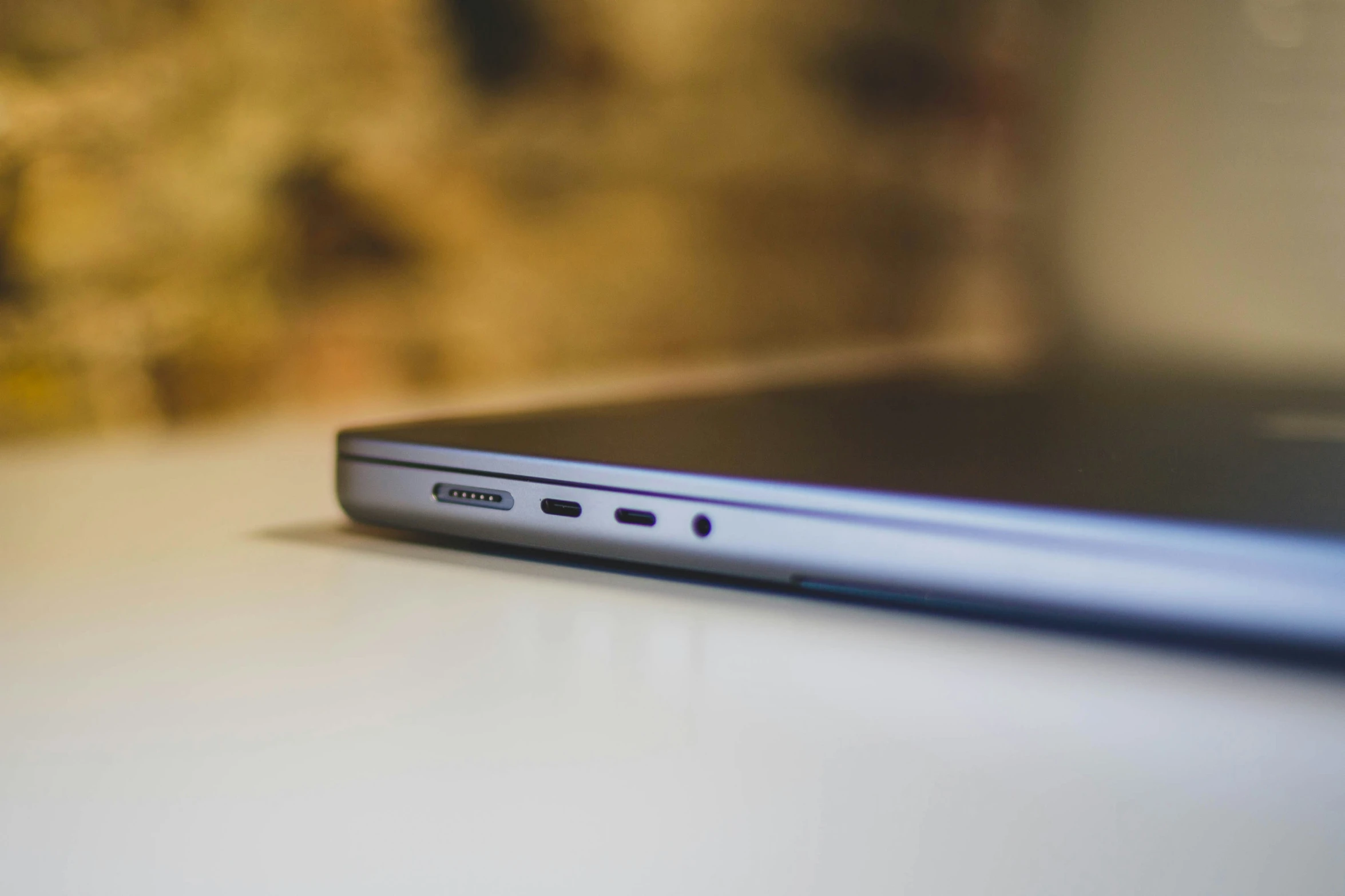 closeup of a laptop on a table with blurry images