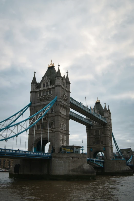 tower bridge in the afternoon, with light clouds in the background