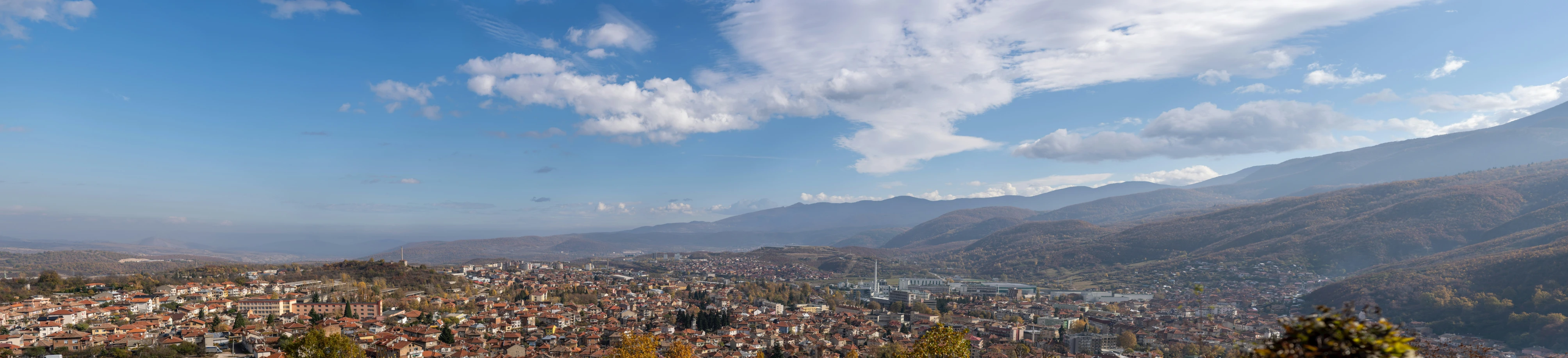 a very colorful city perched on a mountain side