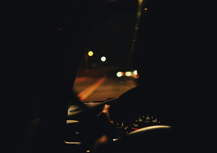 a car windshield in the dark with headlights out