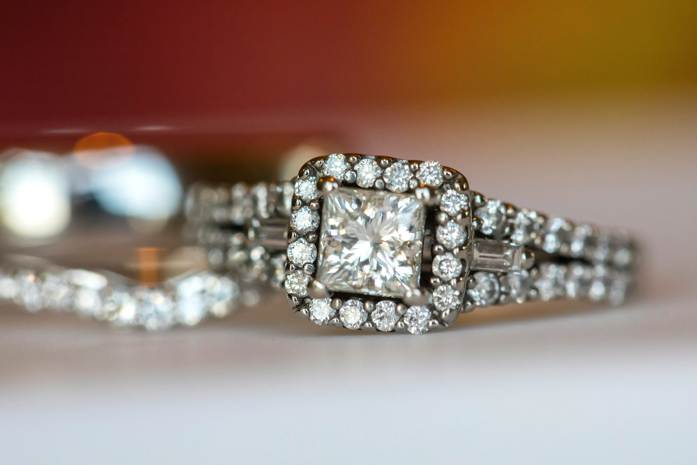 two diamond rings that are sitting on top of each other