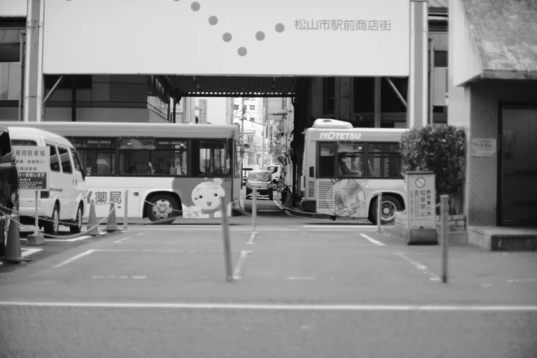 two buses parked in front of a building